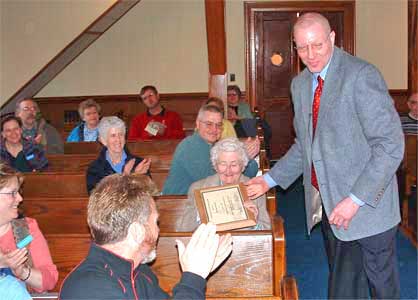 Thelma Asleson receiving her plaque