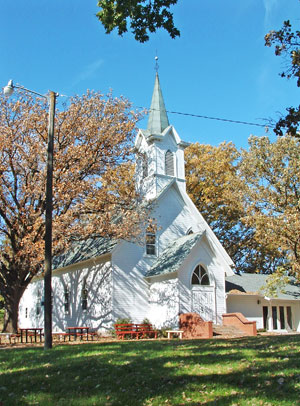 A photo of Nora church in the fall.